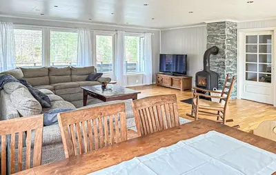 a living room with a couch and a fireplace at Beautiful Home In Kvammen With House A Panoramic View in Kvammen