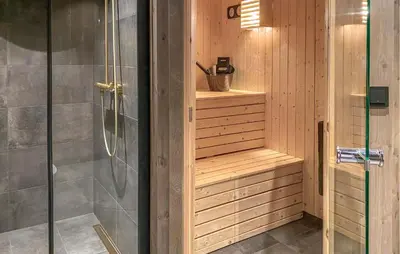 a shower with a glass door in a bathroom at Lovely Home In Bjorli With Sauna in Bjorli
