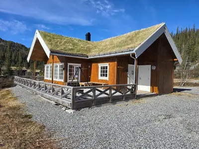 a small house with a grass roof at Cozy Cabin Retreat in Fl, Norway - Perfect for Families and Nature Lovers in Flå