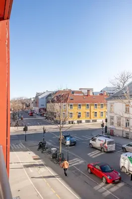 a view of a city street with cars parked at 3FF - Newly renovated studio apt in the middle of the city centre in Trondheim