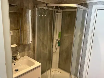 a bathroom with a shower and a sink at 4 person holiday home in Eidsvåg in Eidsvåg