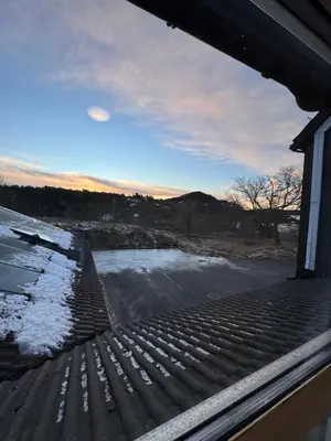 a view from the roof of a house with snow at Siggjo Guesthouse Bømlo and Stord in Mosterhamn