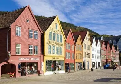 a group of colorful buildings in a street at Perfect Location by Bryggen in Bergen