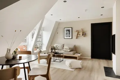a living room with a table and a couch at Relaxed apartment with a view in Bergen