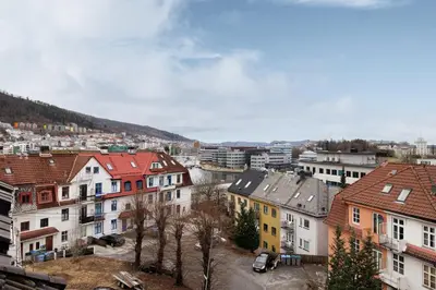 a view of a city with buildings and trees at Relaxed apartment with a view in Bergen