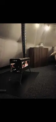 a room with a bed and a table with a lamp at Torshaug glamping in Trondheim
