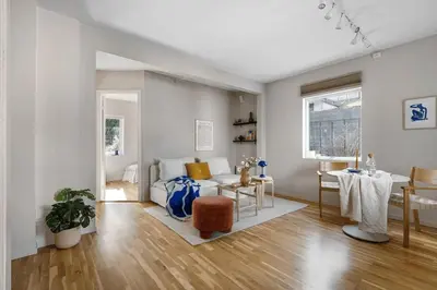 a living room with a couch and a table at Cozy 2-bedroom apartment near Bergen City Centre in Bergen