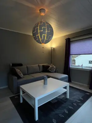 a living room with a couch and a coffee table at Your home in Kristiansund in Kristiansund