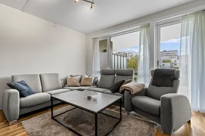 a living room with a couch and two chairs and a table at Convenient Bergen Stay with Easy Transport Connections in Bergen