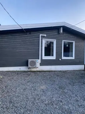 a house with a air conditioner on the side of it at Furnished outhouse in Bergen
