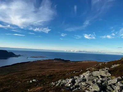 a view of the ocean from the top of a hill at Unik og moderne microhytte med utsikt mot havet 40 A in Longva