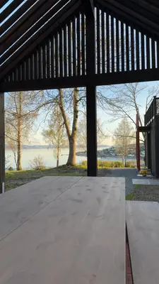 a large woodenilion with a view of the water at NerSalberg Farm