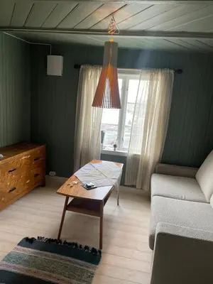 a living room with a couch and a coffee table at NerSalberg Farm