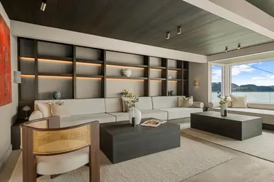 a living room with a couch and a table at Villa with pool and panorama - friend trip,company outing in Trondheim