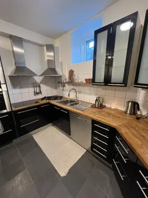a kitchen with a sink and a counter top at Apartment in the heart of Bergen in Bergen