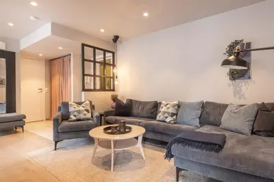 a living room with a couch and a table at Nice apartment with three bedrooms in the middle of Bergen! in Bergen