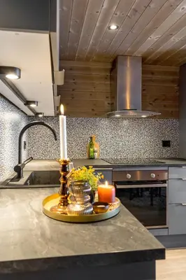 a candle on a counter in a kitchen at Modern apartment in Golsfjellet in Gol