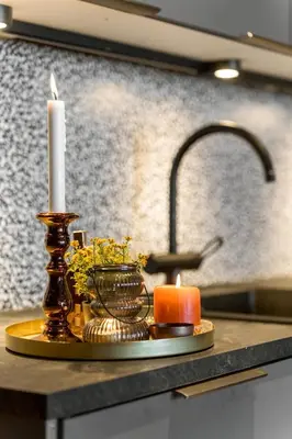a candle sitting on a counter with a sink at Modern apartment in Golsfjellet in Gol