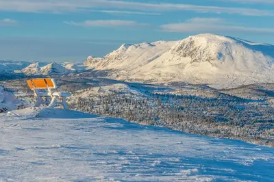 a view of a snow covered mountain with a sign at Modern apartment in Golsfjellet in Gol