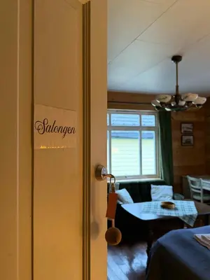 a door to a room with a table in a room at Davik Fjordparadis