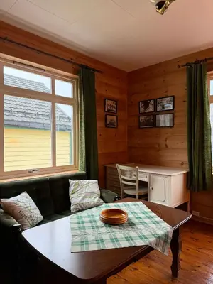 a living room with a couch and a table at Davik Fjordparadis