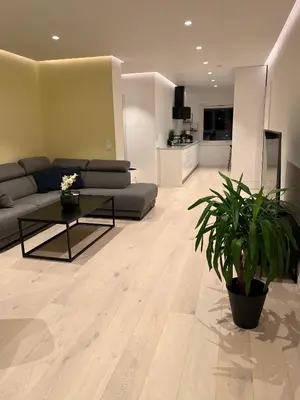 a living room with a couch and a table at Nordic Apartment near by the city in Bergen