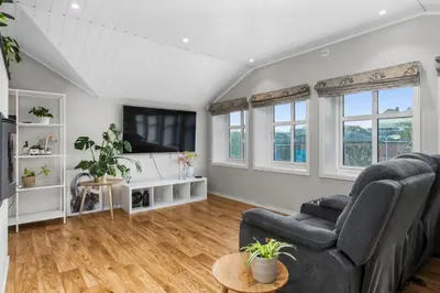 a living room with a couch and a tv at Konsul Moes Gate 4 in Verdal