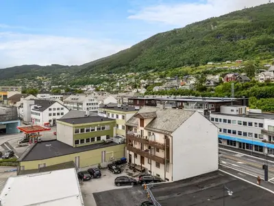 an aerial view of a city with a mountain at Big apartment - Prime Location - Middle of Voss in Vossevangen