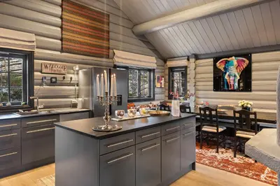 a kitchen with a large island and a dining room at Trysilfjell nord 590 by Vacation Trysil in Trysil
