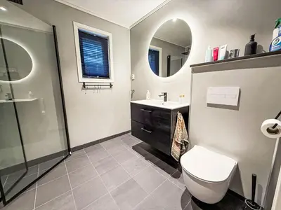 a bathroom with a toilet and a sink and a shower at Holiday Home Høyanger Panorama by Interhome in Høyanger