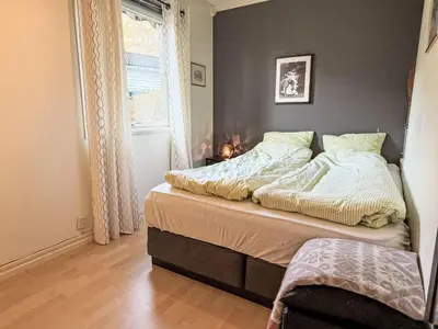 a bedroom with a bed and a window at Holiday Home Høyanger Panorama by Interhome in Høyanger
