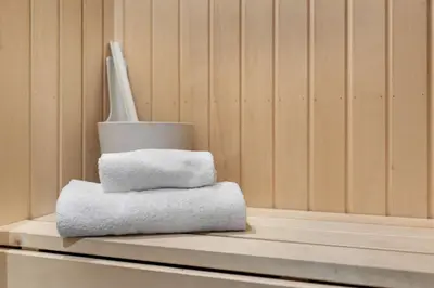 a stack of towels sitting on a shelf in a sauna at Trysiltunet 28A by Vacation Trysil in Trysil