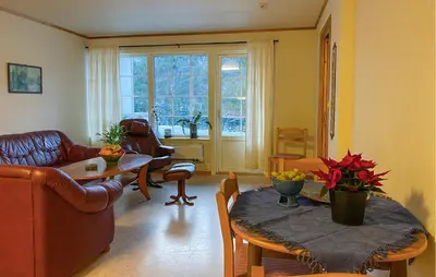 a living room with a couch and a table at Amazing Apartment In Verma With Wifi in Verma
