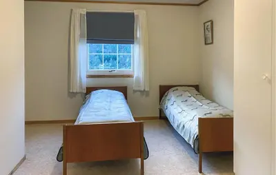 a bedroom with two beds and a window at Amazing Apartment In Verma With Wifi in Verma