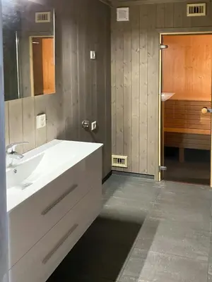 a bathroom with a white sink and a shower at Cabin With Sauna At Norefjell in Noresund
