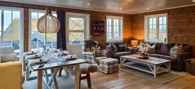 a living room with a couch and a table at Well-Equipped Cabin Near Rauland Alpine Centre in Rauland