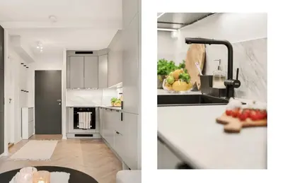 a kitchen with white cabinets and a counter top at Modern and cozy apartment ONLY 5 minutes from City Center in Bergen