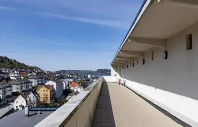 a view of a city from the balcony of a building at Modern and cozy apartment ONLY 5 minutes from City Center in Bergen