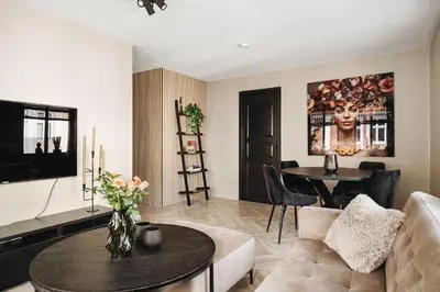 a living room with a couch and a table at Central apartment building in Bergen