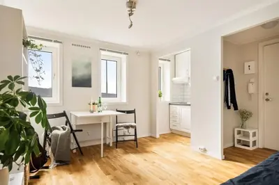 a living room with a desk and a table at Appartment Bergen, Skansen in Bergen