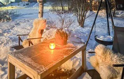 a table in the snow with a candle on it at Cozy Home In Sparbu With Wifi in Sparbu