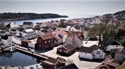 an aerial view of a town next to a body of water at Langesund brygge in Lii