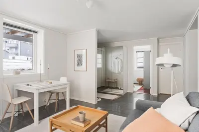 a living room with a couch and a table at Bright and cozy 2-bedroom apartment in Bergen