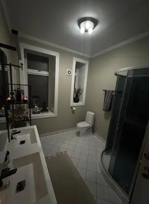 a bathroom with a toilet and a sink and a shower at Central Jugend apartment in Ålesund in Ålesund