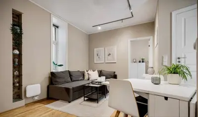 a living room with a couch and a table at Central and cozy apartment in Bergen City Center in Bergen