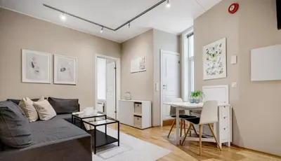 a living room with a couch and a table at Central and cozy apartment in Bergen City Center in Bergen