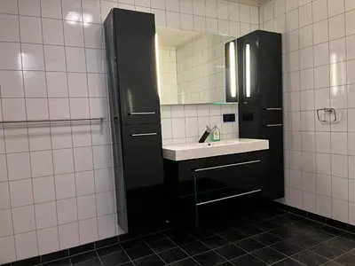 a bathroom with a sink and a mirror at Apartment Stedjeåsen 70 in Sogndal