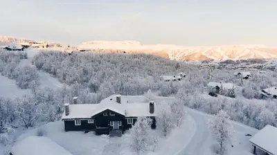 an aerial view of a house covered in snow at Luxury cabin in the mountains, with sauna and steam shower in Geilo