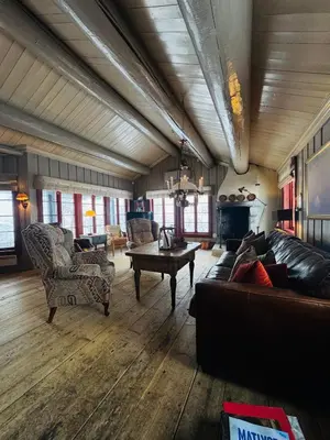 a large living room with couches and a table at Luxury cabin in the mountains, with sauna and steam shower in Geilo