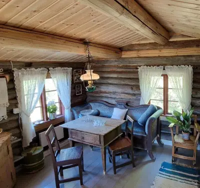 a dining room with a table and chairs at Smia cabin , A Unique Rustic Hideaway in Lii